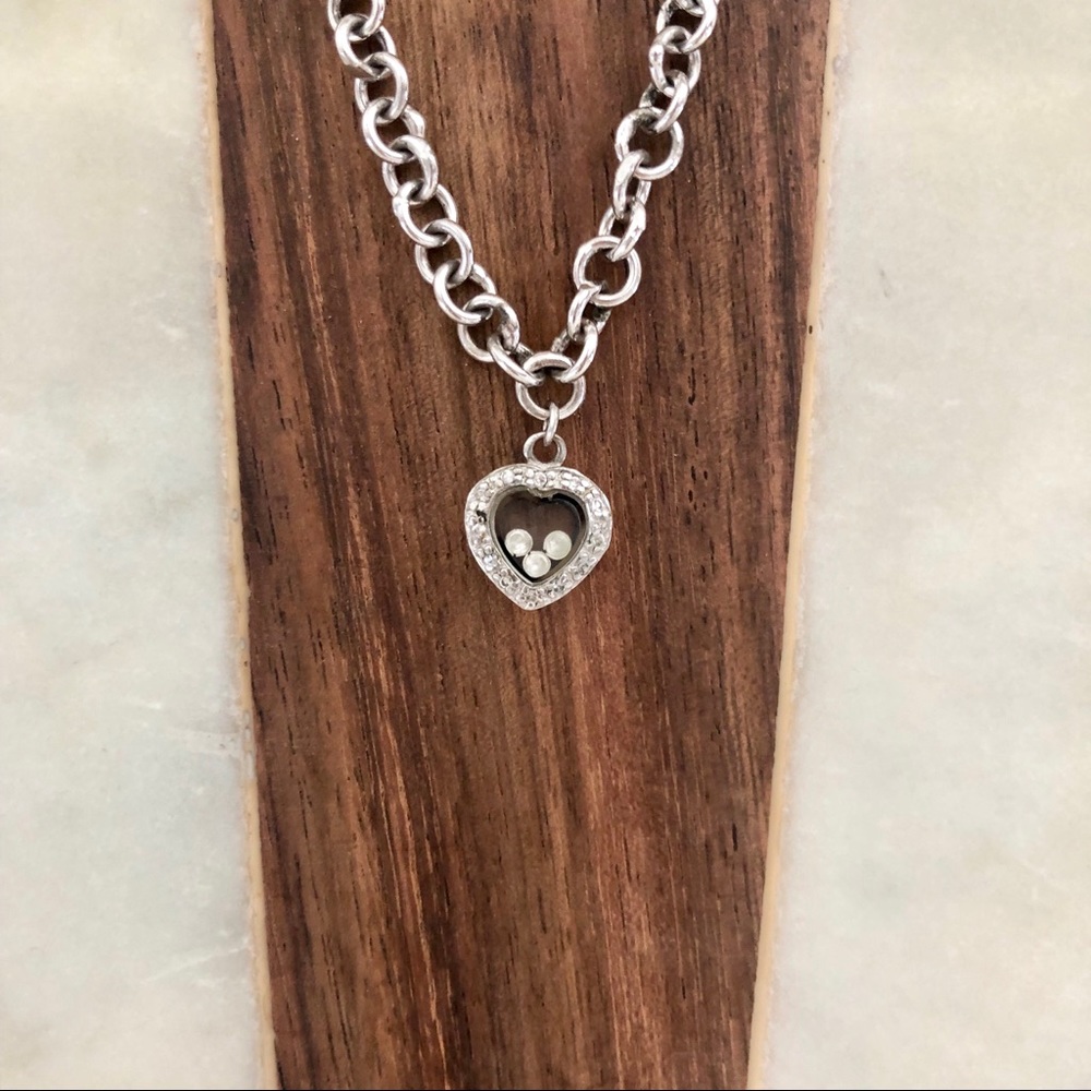Silver toned heart necklace with crystal beads on the interior of glass chain - Picture 3 of 11